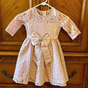 Rare editions size 5 lace dress with bow/rhinestone center.